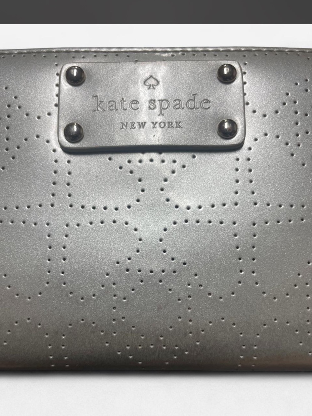 kate spade metallic silver perforated logo wallet